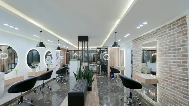 Intérieur d'un salon de coiffure moderne avec fauteuils noirs et miroirs ronds